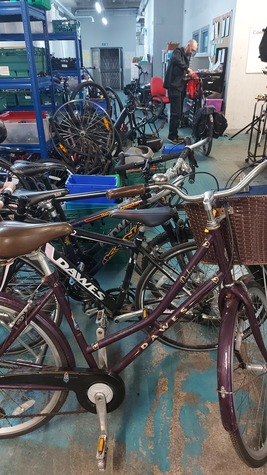Bikes being refurbished at CGX Cycle Works by local staff and volunteers